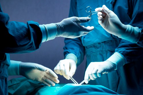Medical staff perform surgery.